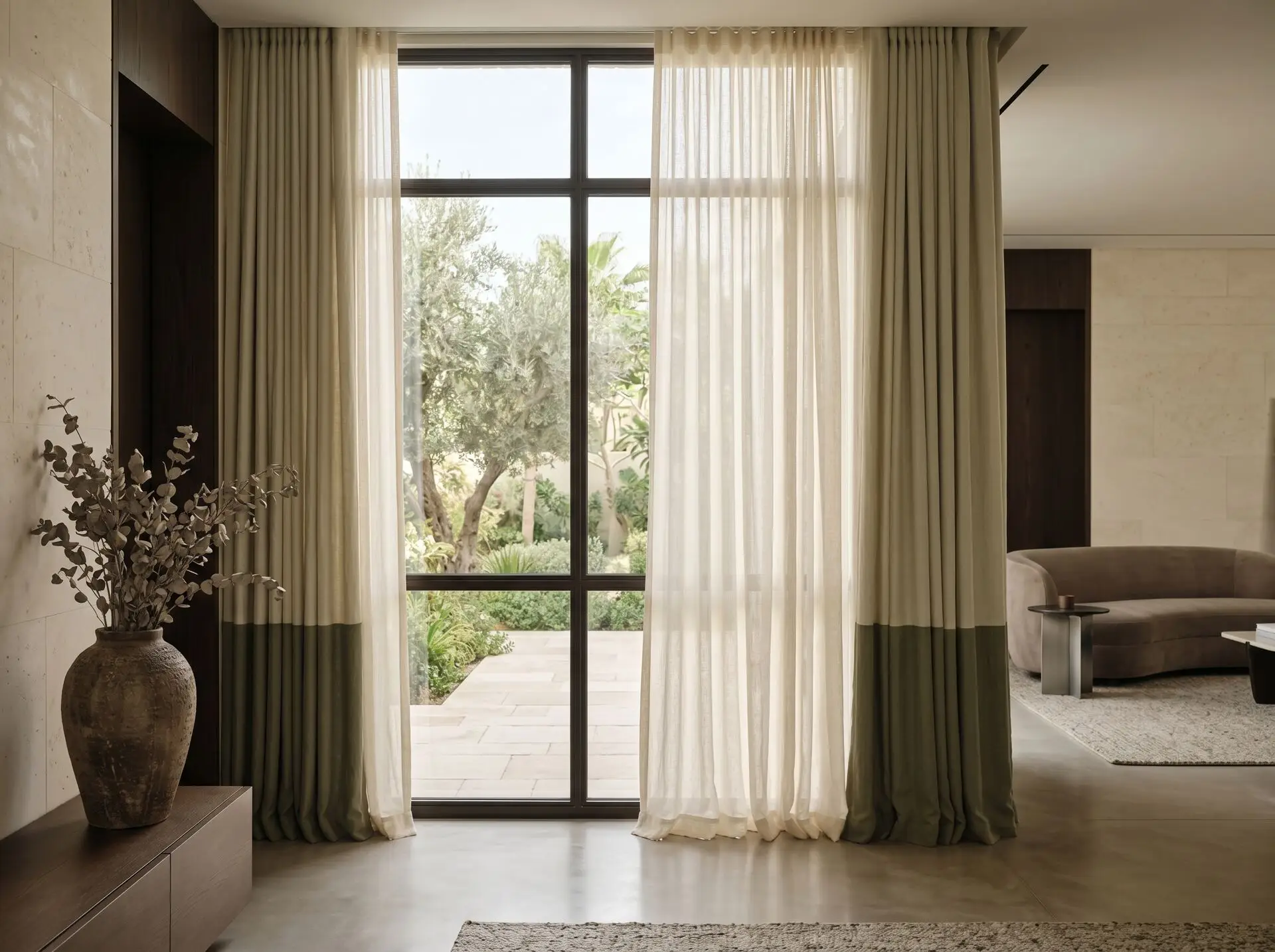 Layered sheer and blackout curtains in a luxury Dubai villa